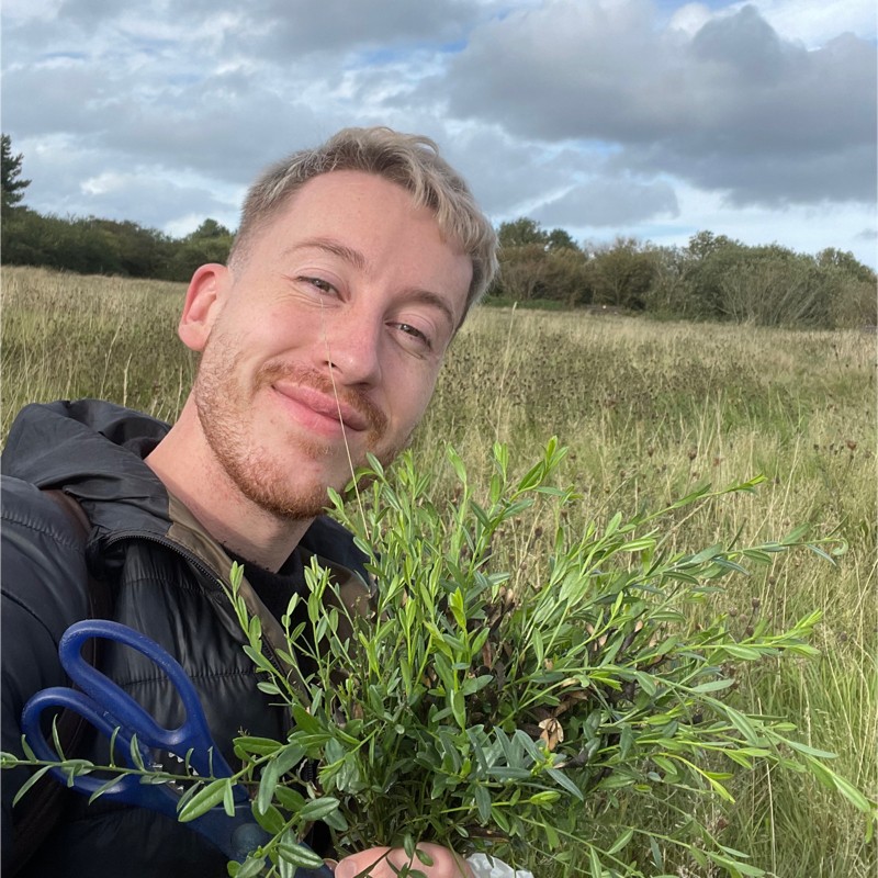 Director holding plant
